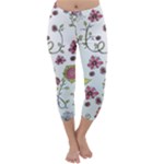 Pink whimsical flowers on blue Capri Winter Leggings 