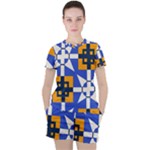 Shapes on a blue background                                                           Women s Mesh Tee and Shorts Set