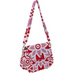 A Red And White Pattern With A Flower On It Saddle Handbag