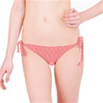 A Red And White Background With A Pattern Bikini Bottoms