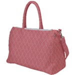 A Red And White Background With A Pattern Duffel Travel Bag