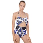 A Design Of A Blue And Black Flower Scallop Top Cut Out Swimsuit