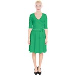 A Green Background With A White Border Wrap Up Cocktail Dress