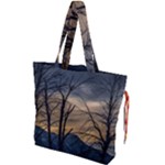 Tree silhouette at border of nahuel haupi lake, rio negro, argentina Drawstring Tote Bag