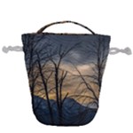 Tree silhouette at border of nahuel haupi lake, rio negro, argentina Drawstring Bucket Bag