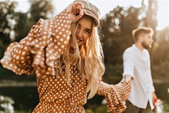 stylish young woman holding hand boyfriend park curly blonde girl brown outfit enjoys walk