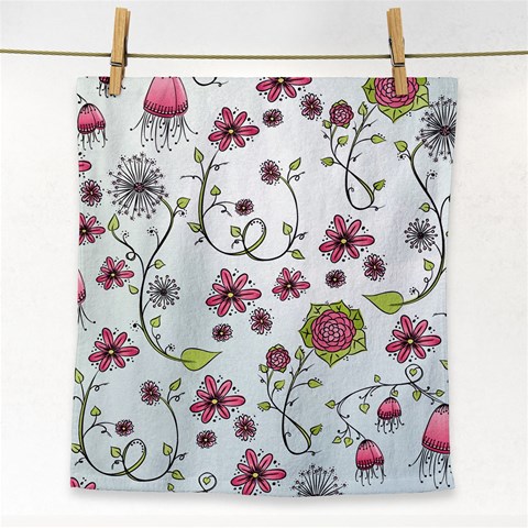 Pink whimsical flowers on blue Face Towel from ArtsNow.com Front