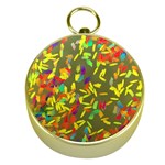 Colorful brush strokes painting on a green background                                                    Gold Compass