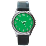 A Green Background With A White Border Round Metal Watch