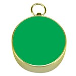 A Green Background With A White Border Gold Compasses